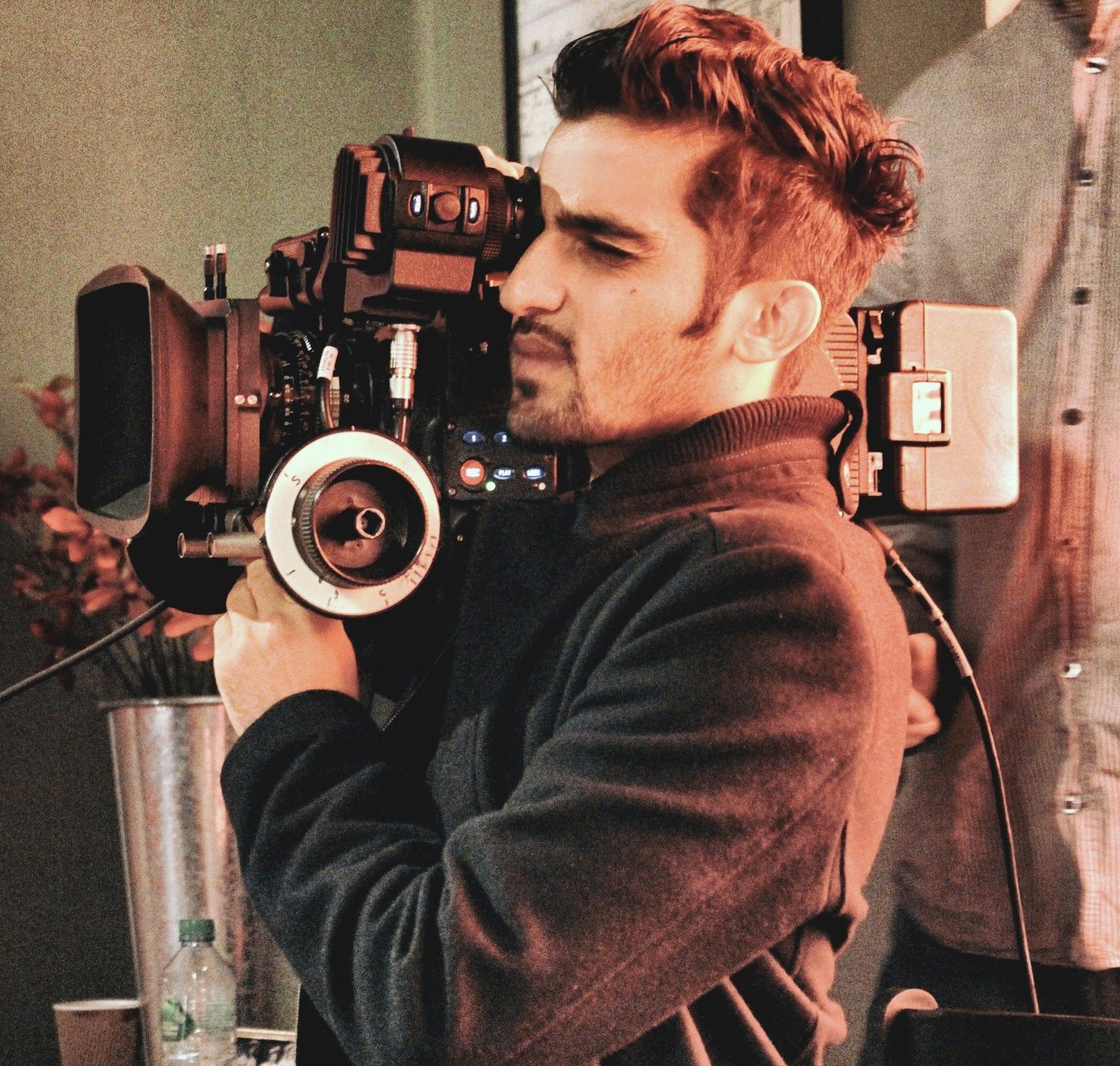 Filmmaker holding Arri Alexa film camera, filming a short film, Filmset, film school, man working